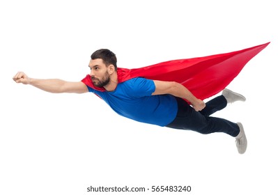 freedom, power, motion and people concept - man in red superhero cape flying in air