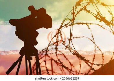 Freedom of speech and democracy concept. Double exposure - camera, barbed wire and flag Iran