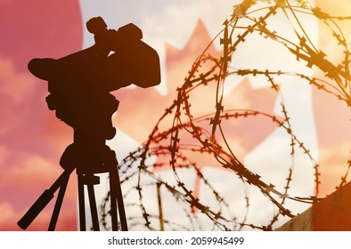 Freedom Of Speech And Democracy Concept. Double Exposure - Camera, Barbed Wire And Flag Canada