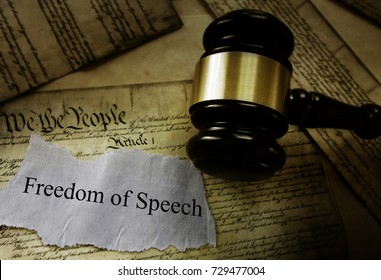 Freedom of Speech message on pages of the US Constitution with court gavel -- First Amendment concept