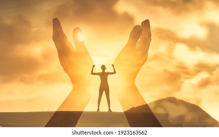 Freedom a spirituality concept. 
strong young woman feeing inspired with worshiping hands raised to the sun light. 