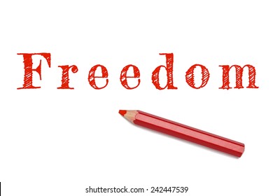 Freedom text written red pencil white background. Concept freedom of speech and expression.