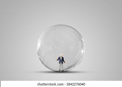 Freedom And Think Outside Box Concept : Businessman Standing In The Sphere Glass On Gray Background.