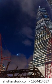 Freedom Tower - One World Trade Center At Night Time From Below With Cranes And Construction And Building Site Below 