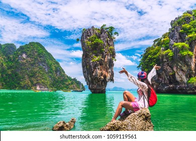 Freedom Traveler Woman Relaxing On Rock Joy View Of James Bond Island, Phang Nga Bay, Near Phuket, Adventure Nature Travel In Thailand, Beautiful Destination Landscape Place Asia, Summer Vacation Trip