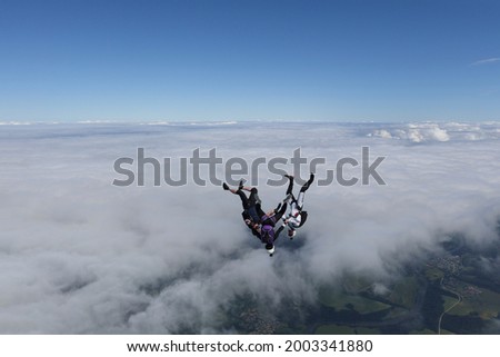 Freefly skydiving. Skydivers are falling headdown possition.