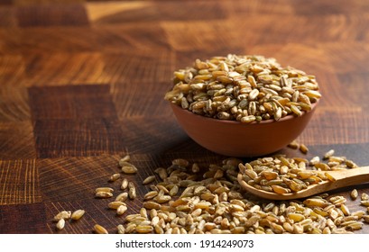 Freekeh Grain On A Dark Wooden Butcher Block