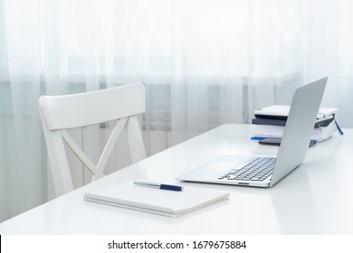 Freelance Desk With Laptop. Distance Education. Quarantine, Self-isolation, Sociophobia. Online Learning, Teleworking, Online Lectures. Concept Of Digital Nomads, Home Office, Blogging. No People.