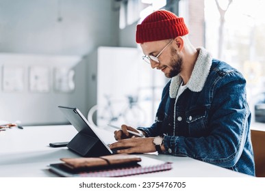 Freelance graphic designer working in bright room - Powered by Shutterstock