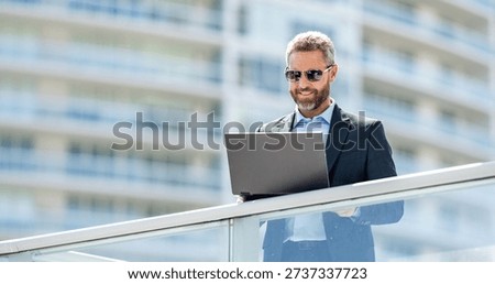 Freelance man working online. Freelance working online. Man using laptop for freelancing. Business freelancing. Man checking email outdoor. Communication online. Man with laptop banner