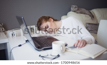 Freelance and remote work. Abnormal working hours, Chronic fatigue syndrome and low energy, the girl fell asleep at the workplace