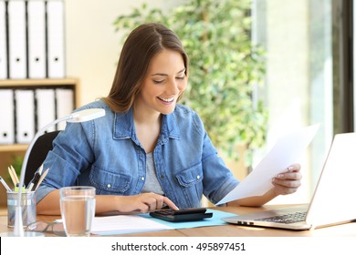 Freelance woman calculating a budget in a desktop at office
