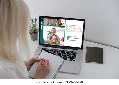 Freelancer, distant working, elearning concept. Young smiling pretty woman worker sitting and looking at laptop screen during videocall, online lecture. Distant learning, connection