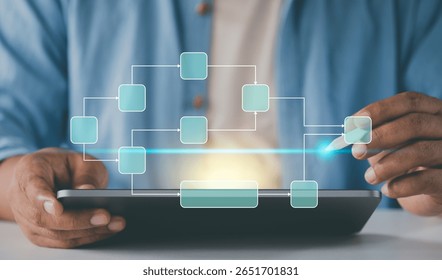 Freelancer using tablet make data flow diagram. Workflow scheduling interface. Business professional analyzing. tracking decomposition progress. manage data process system. Digital strategy dashboard