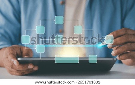 Freelancer using tablet make data flow diagram. Workflow scheduling interface. Business professional analyzing. tracking decomposition progress. manage data process system. Digital strategy dashboard