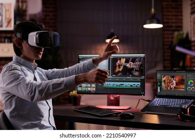 Freelancer using vr glasses to edit movie footage with computer software app. Videographer editing film montage with visual and sound effects, creating video for multimedia production.