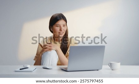 Freelancer woman talk using web cam on laptop computer. Home e learning concept. Remote work conference during covid 19. Girl wear yellow t shirt. Online education tutor video call. Corona virus job.
