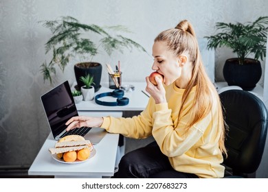 Freelancer Young Woman Eating Healthy Food When Working From Home. Woman Eating Healthy Grain Snacks And Fruits While Working With Laptop At Home Office