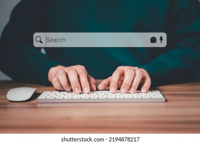 Freelancer's hand using a computer keyboard to search for information, job search. Business ideas for applying search to your website.