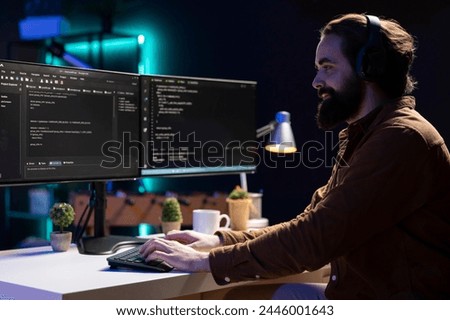 Freelancing programmer hearing audiobooks while designing and developing software applications. IT specialist enjoying podcasts while implementing and maintaining company systems