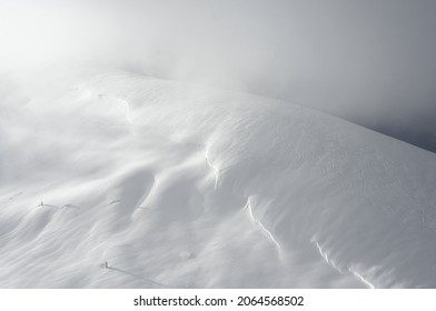 Freeride ski trail on a mountain slope. The mountain range is covered with snow. Winter mountain landscape. - Powered by Shutterstock