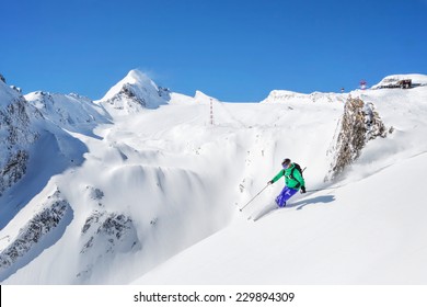 Freeride skiier in the mountains