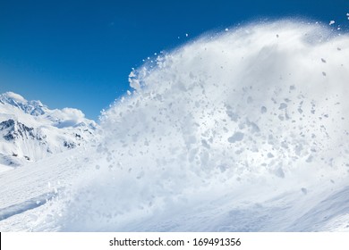 Freerider snowboarder moving down in snow powder 