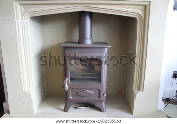 Freestanding Log Burning Fireplace White Surround Stock Image
