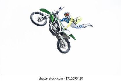 The Freestyle Motocross. Biker Stunt Rider Doing A Jump And Perfom Acrobatic Stunt Flying. Fmx Motocycles