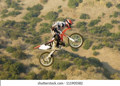 Freestyle Motocross Racer Performing Stunt