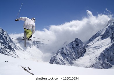 Freestyle Ski Jumper With Crossed Skis In High Mountains