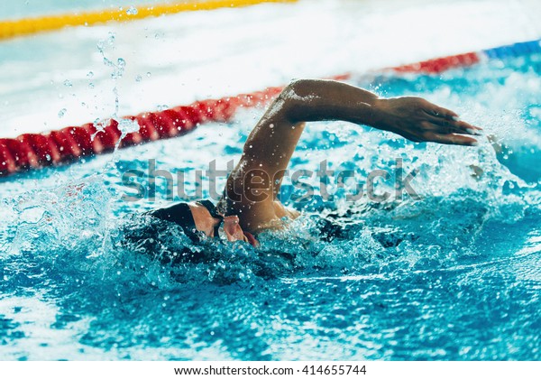Freestyle swimming\
competitor in action