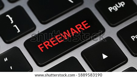FREEWARE word on a keyboard. Programming and IT concept.