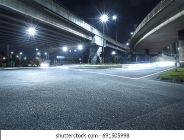 Freeway In Night With Cars Light In Crossroads