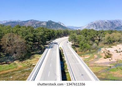 Freeway Road, Bridge, Mountain, Highway In Forest. Aerial View, 4K Video Shooting.