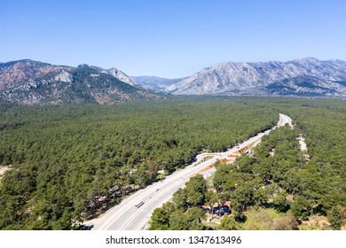 Freeway Road, Mountain, Highway In Forest. Aerial View, 4K Video Shooting.