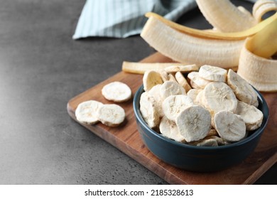 Freeze Dried And Fresh Bananas On Grey Table. Space For Text