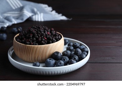 Freeze Dried And Fresh Blueberries On Wooden Table. Space For Text