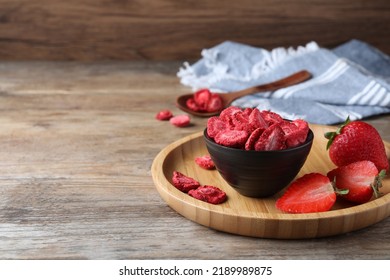 Freeze Dried And Fresh Strawberries On Wooden Table. Space For Text