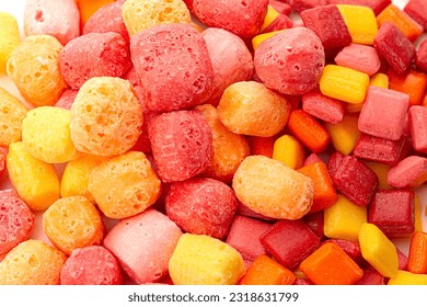Freeze Dried Rainbow Flavored and Pastel Colored Chewy Candy Squares Isolated on a White Background - Shutterstock ID 2318631799