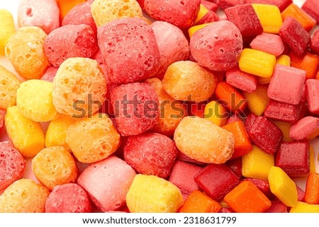 Freeze Dried Rainbow Flavored and Pastel Colored Chewy Candy Squares Isolated on a White Background