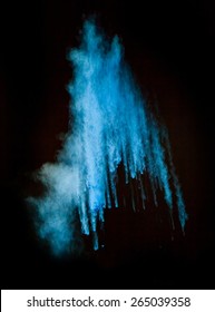 Freeze Motion Of Blue Dust Explosion Isolated On Black Background