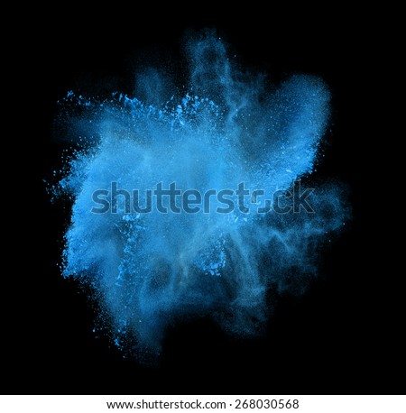 Freeze motion of blue powder exploding, isolated on black, dark background. Abstract design of white dust cloud. Particles explosion screen saver, wallpaper with copy space. Planet creation concept