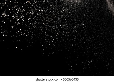 Freeze Motion Of Color Powder Coming Down On Black Background,Abstract Design Of Falling Dust Cloud, Snow Fall Concept.