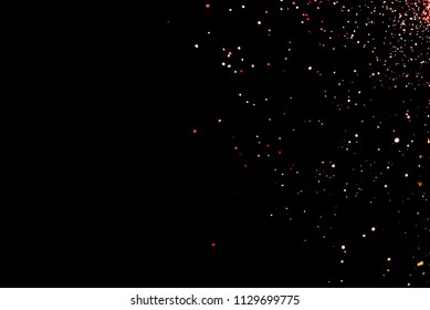 Freeze motion of color powder exploding/throwing color powder.