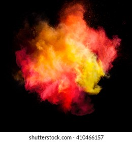 Freeze motion of colored dust explosion isolated on black background