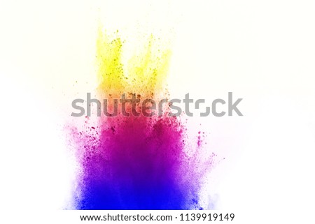 Freeze motion of colored powder explosion isolated on white background. Abstract of Multicolor dust splatted.