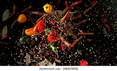 Freeze motion of flying various kinds of spices isolated on black background. Studio shot. - Powered by Shutterstock