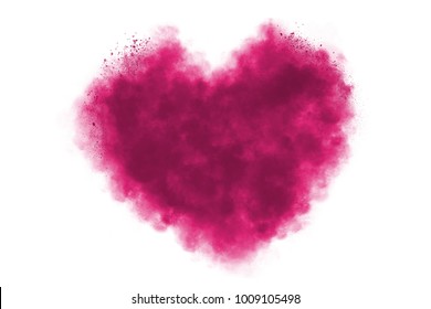Freeze motion of heart shaped powder isolated on white background. Abstract design of dust cloud. Particles explosion screen saver, wallpaper with copy space. Love, passion, feelings concept