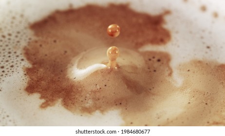 Freeze motion of macro shot of coffee drop beign fall into cup. Ultra detail. - Powered by Shutterstock